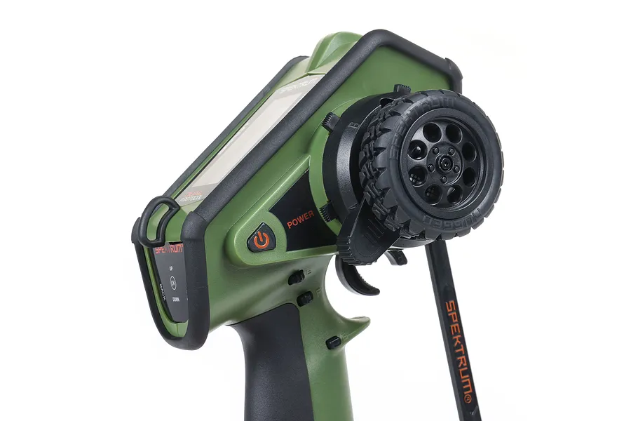 Spektrum DX Rugged DSMR+ 12-channel RC transmitter in olive green with black rubberized bumpers and steering wheel.