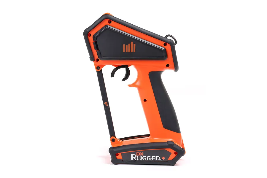 Side view of the Spektrum DX Rugged DSMR+ 12-channel RC transmitter in orange and black, featuring a heavy-duty protective frame.