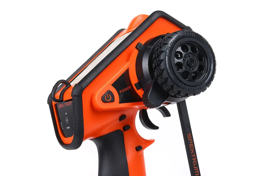 Spektrum DX Rugged orange and black RC surface transmitter with steering wheel and trigger.