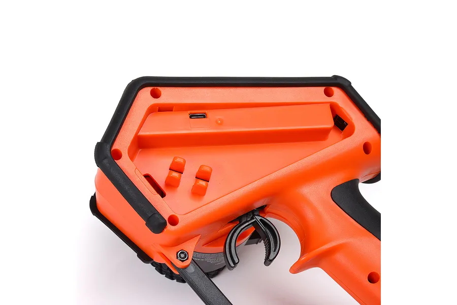 Close-up of the orange and black Spektrum DX Rugged transmitter showing the side profile with USB port and adjustment controls.