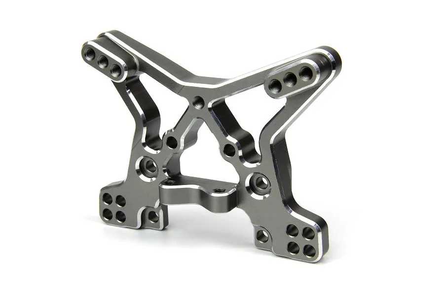 A grey anodized aluminium front shock tower for an RC car, featuring multiple mounting holes and a machined design.