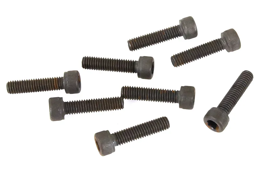A collection of eight dark grey metal cap head screws scattered on a white background.