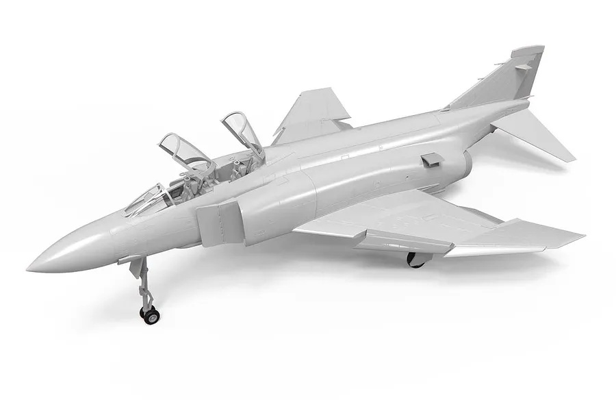 A grey, unpainted plastic model kit of a McDonnell Douglas Phantom fighter jet, shown from a high-angle front three-quarter view.