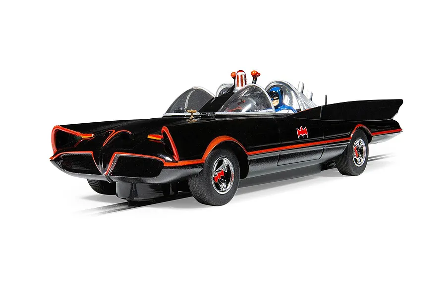 A 1/32 scale Scalextric Batmobile slot car in black with red trim, featuring a Batman figure in the cockpit, set against a white background.