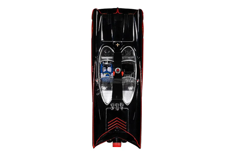 Top-down view of a 1/32 scale Scalextric Batmobile slot car with a black body, red trim, and a Batman figure in the cockpit.