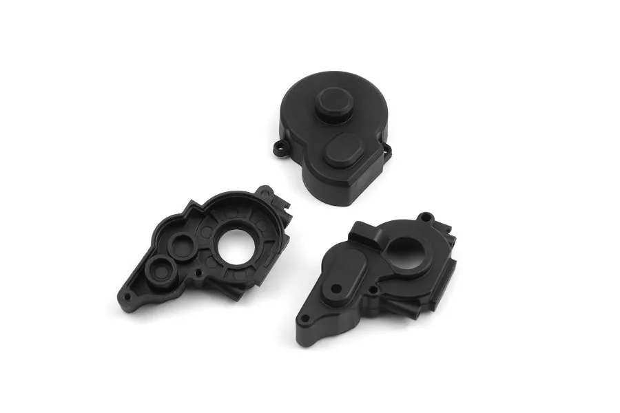 Three black plastic RC gearbox case components arranged on a white background.