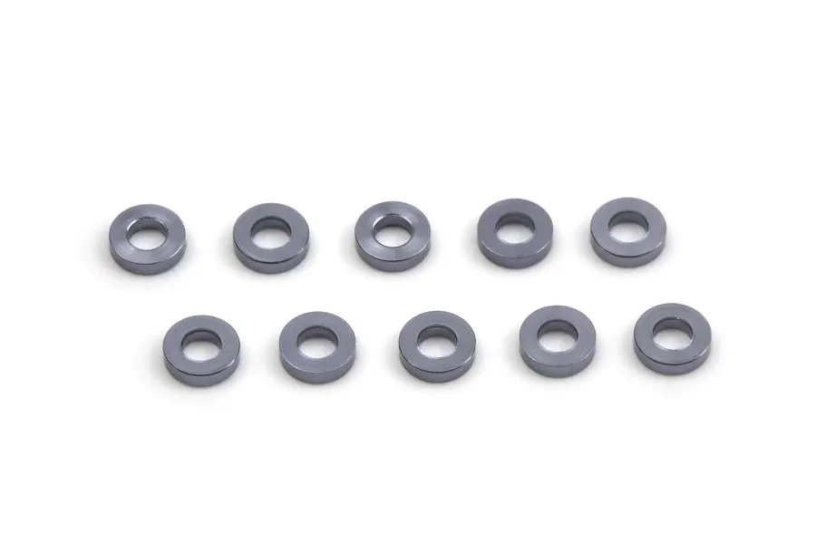 Ten small gunmetal-coloured aluminium shims arranged in two rows of five on a white background.