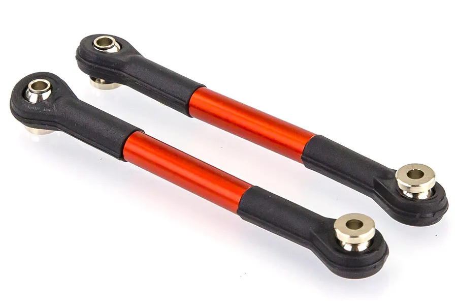 Two orange anodized aluminum RC suspension linkages with black plastic rod ends and metal pivot balls on a white background.