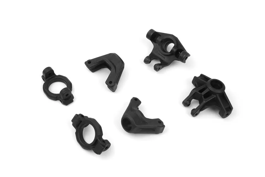 A set of black plastic RC car suspension parts including steering hubs, C-hubs, and rear hubs on a white background.