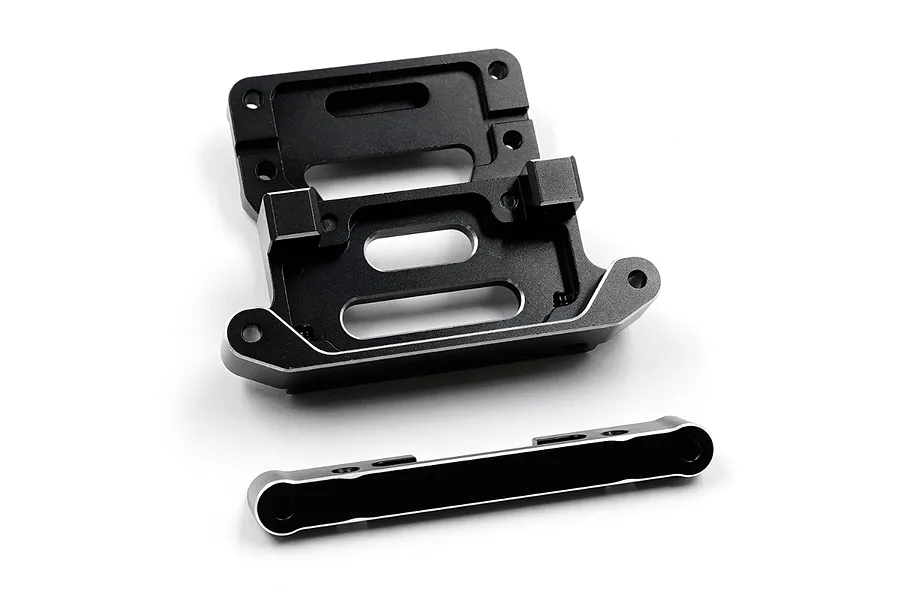 A black anodized aluminium rear shock tower mount and a separate arm mount for an RC car, set against a plain white background.