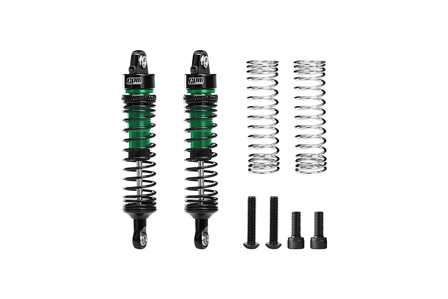 Two GPM Racing green and black aluminium RC shock absorbers with extra springs and mounting hardware on a white background.