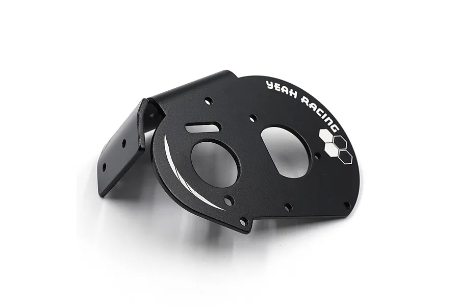 A black aluminium motor mount plate for RC cars by Yeah Racing, featuring a curved design with mounting holes and white branding.