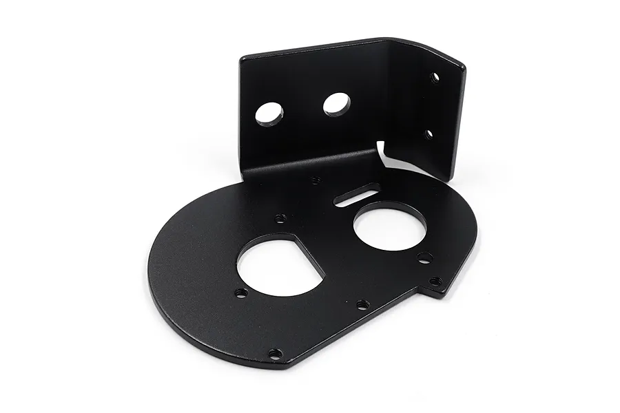 A black aluminium motor mount plate for RC cars, featuring a flat base with circular cutouts and an L-shaped vertical bracket with mounting holes.