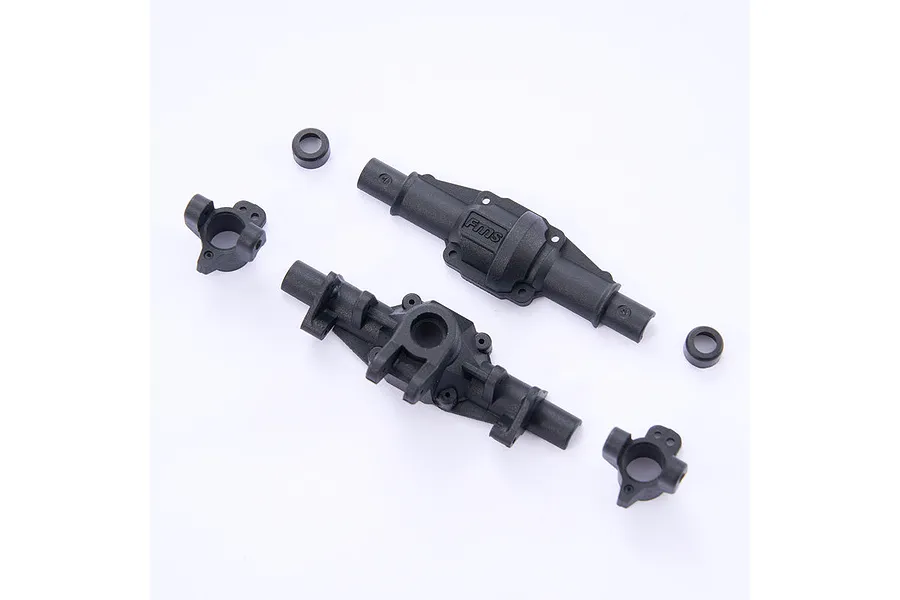 FMS front axle housing components including two main housing halves, two steering knuckles, and two small bushings on a white background.