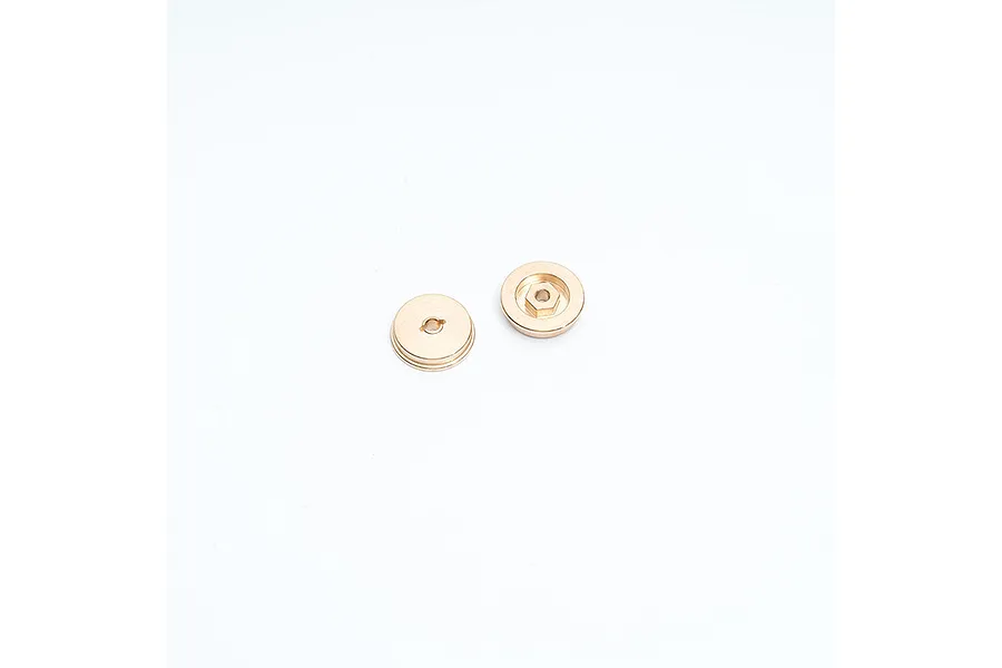Two circular brass wheel counterweights for RC cars, shown from front and back views against a white background.