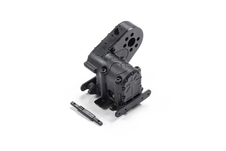 A black plastic RC transmission gearbox assembly and a separate small plastic driveshaft component on a white background.