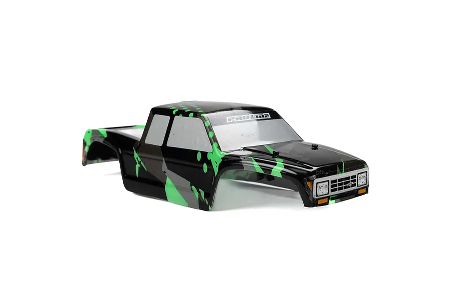 Pro-Line Coyote RC truck body shell with a black and green tear paint scheme, featuring a Pro-Line logo on the windshield.