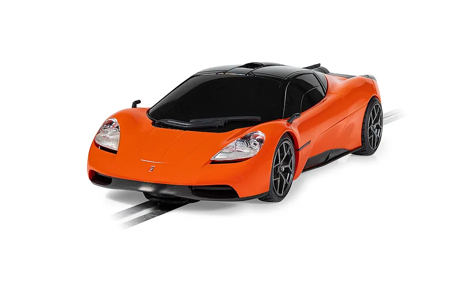 A bright orange Scalextric 1/32 scale GMA T.50 slot car on a track against a white background.