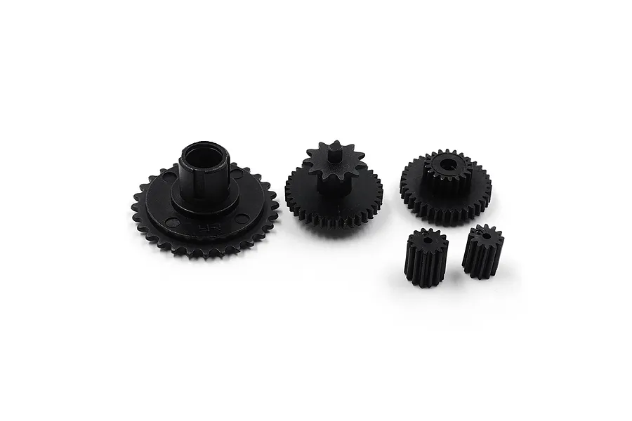 A set of five black nylon RC gears of varying sizes arranged on a white background.