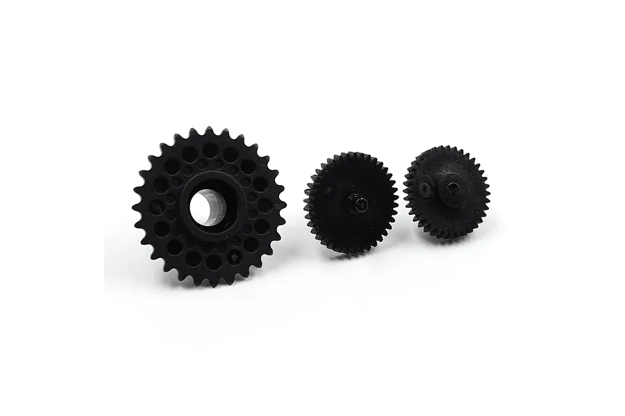 Three black nylon RC gears of varying sizes arranged in a row on a white background.