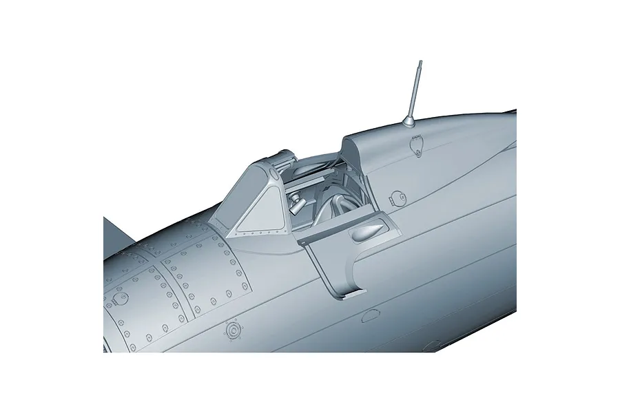 Close-up of the cockpit area of an unpainted grey plastic model aircraft kit, showing detailed panel lines and rivets.