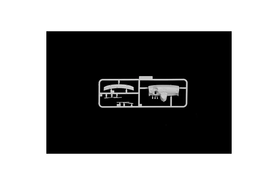 A white plastic model kit sprue containing interior dashboard parts for a 1/24 scale Fiat 500 Abarth model car.