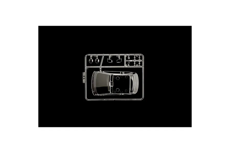 A clear plastic sprue containing the roof and small window parts for a 1/24 scale model car kit.