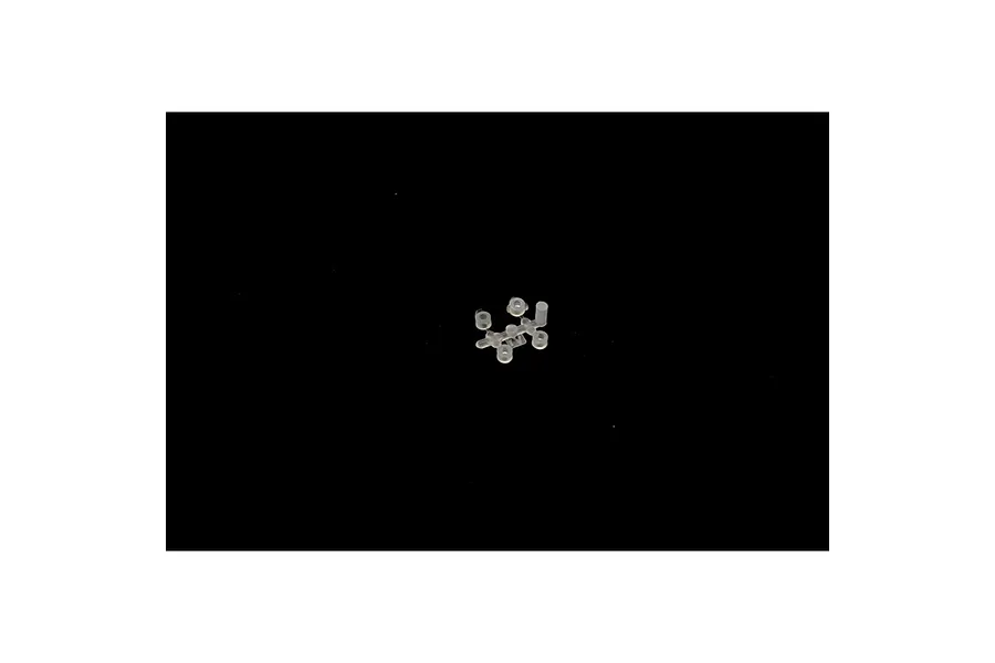 A small sprue of clear plastic parts for a model kit, isolated on a black background.