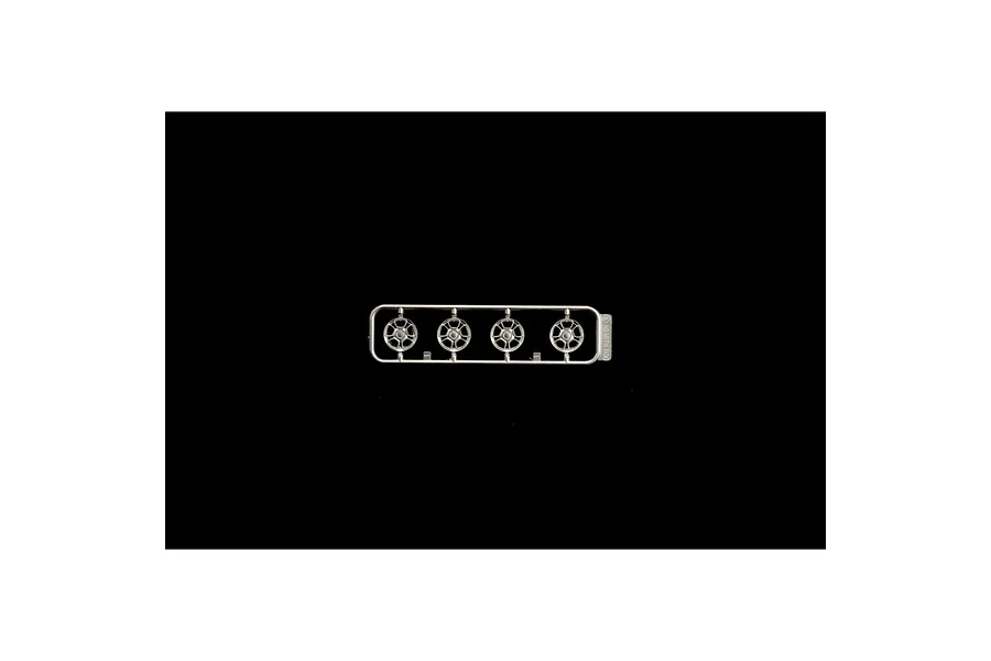 A plastic model kit sprue containing four silver-colored car wheels for an Italeri 1/24 scale Fiat 500 Abarth model.