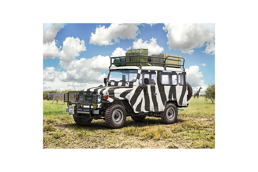 A box art illustration of an Italeri 1/24 scale Toyota Land Cruiser Safari model kit featuring a zebra-striped off-road vehicle in a savanna setting.