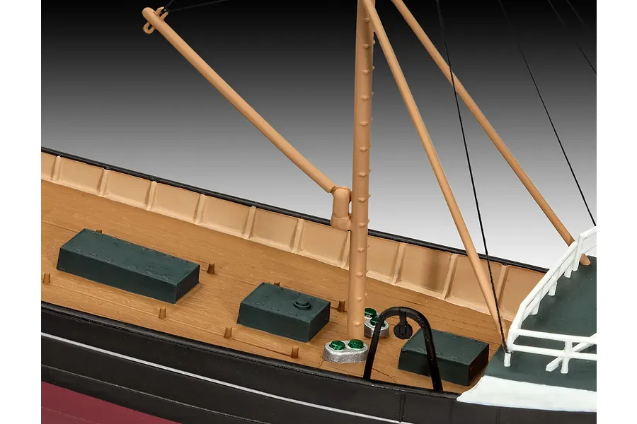 Close-up of the deck of a Northsea Fishing Trawler model kit showing the mast, rigging, and deck structures.
