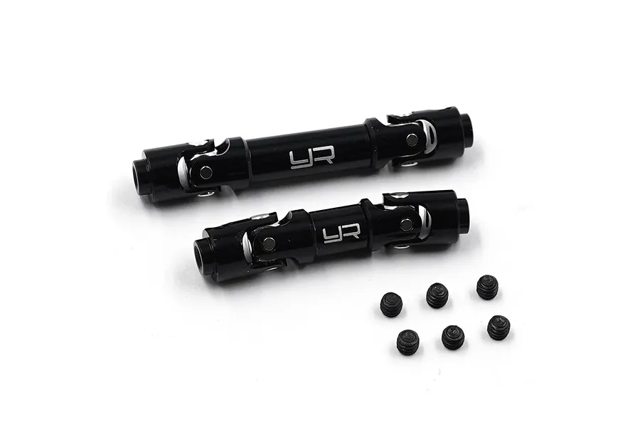 Two black aluminium RC centre driveshafts with universal joints and six small grub screws on a white background.