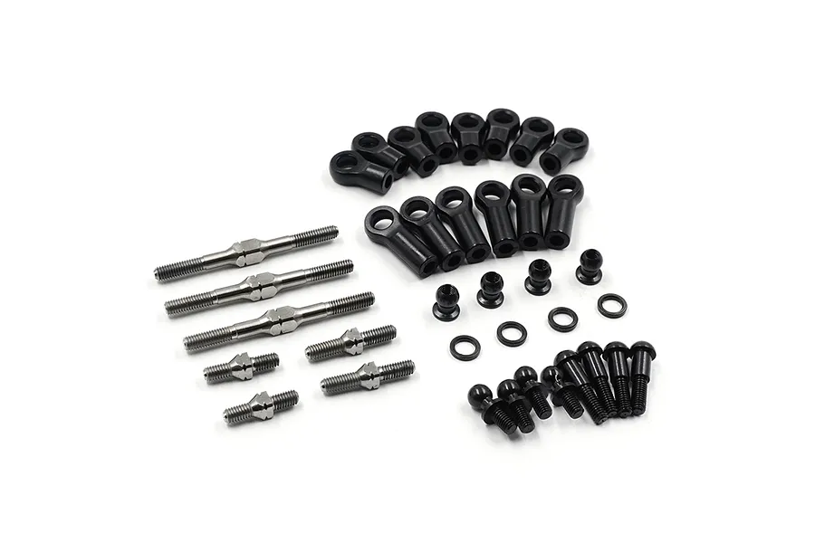 A set of Yeah Racing titanium turnbuckles, black plastic rod ends, ball studs, and washers arranged on a white background.