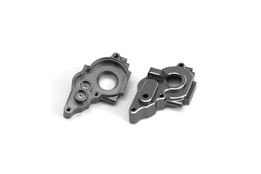 Two grey aluminium gearbox case halves for a Maverick RC vehicle, shown from front and back angles on a white background.