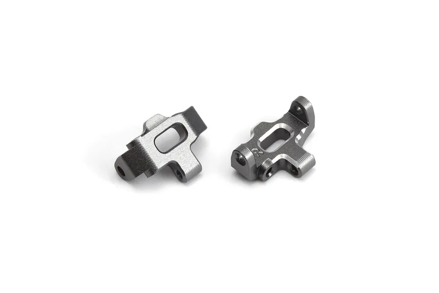Two grey aluminium C-hub carriers for an RC car, shown from different angles on a white background.