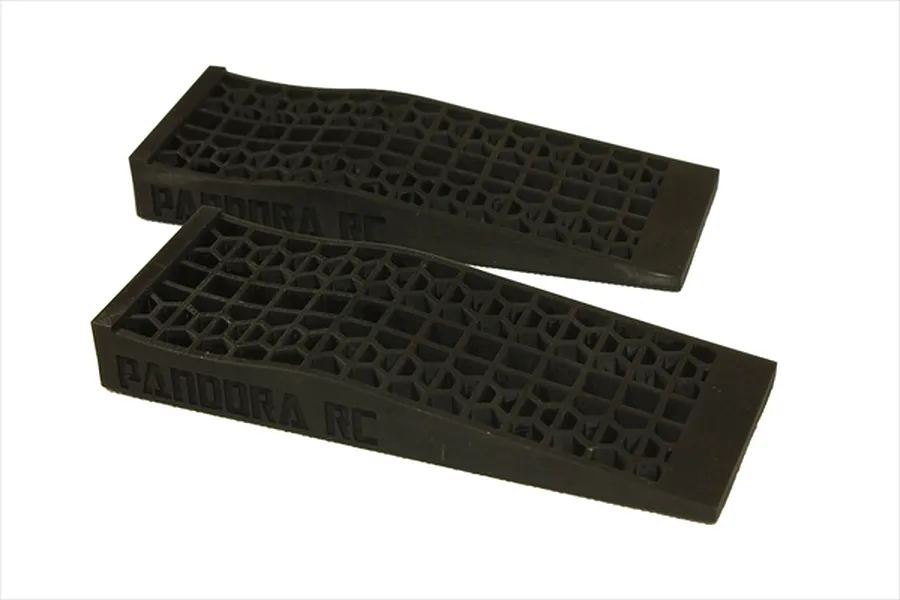 Two black plastic RC car ramps with a grid-pattern surface and Pandora RC branding on the side, set against a white background.