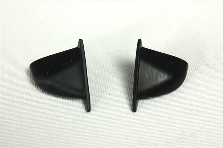 A pair of black plastic aero door mirrors for a 1/10 scale RC car body shell.