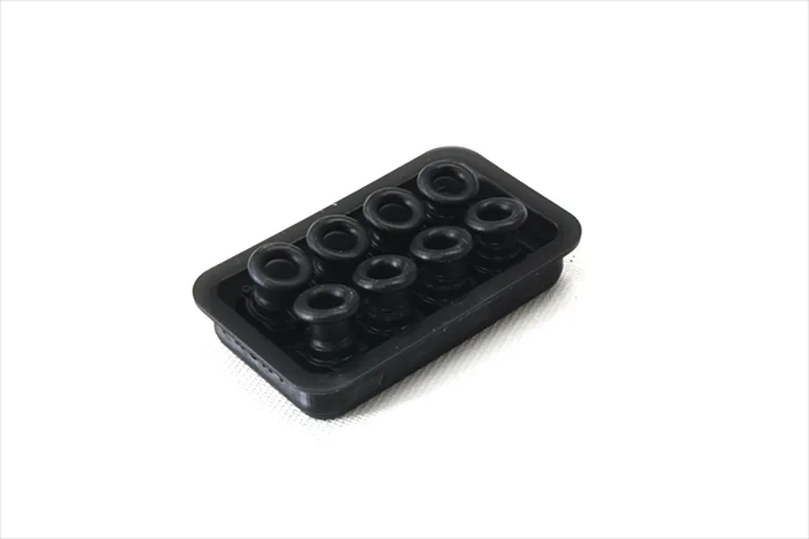 A set of eight small black plastic velocity stacks arranged in a rectangular tray on a white background.