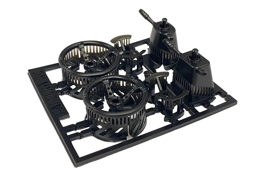 A black plastic sprue containing 1/10 scale RC steering wheel and dashboard accessory parts from Pandora RC.