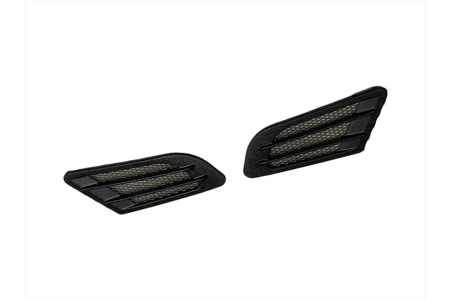 Two black plastic fender duct accessories for 1/10 scale RC car bodies, featuring a mesh grille design.
