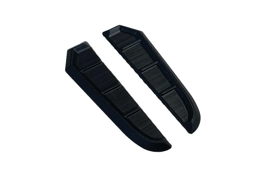 Two black plastic fender duct accessories for 1/10 scale RC car bodies.