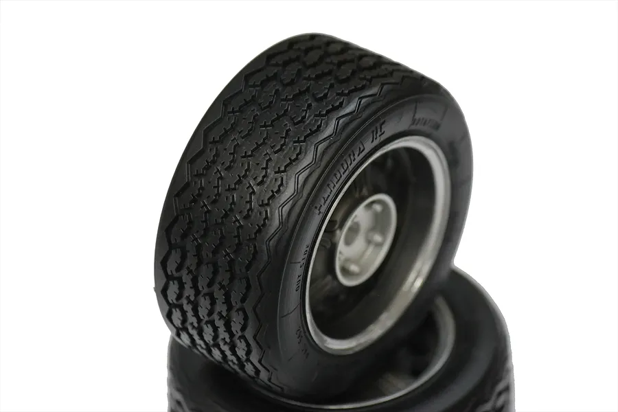 Two Pandora RC 2000GT scale display wheels with detailed tread patterns and silver rims stacked against a white background.