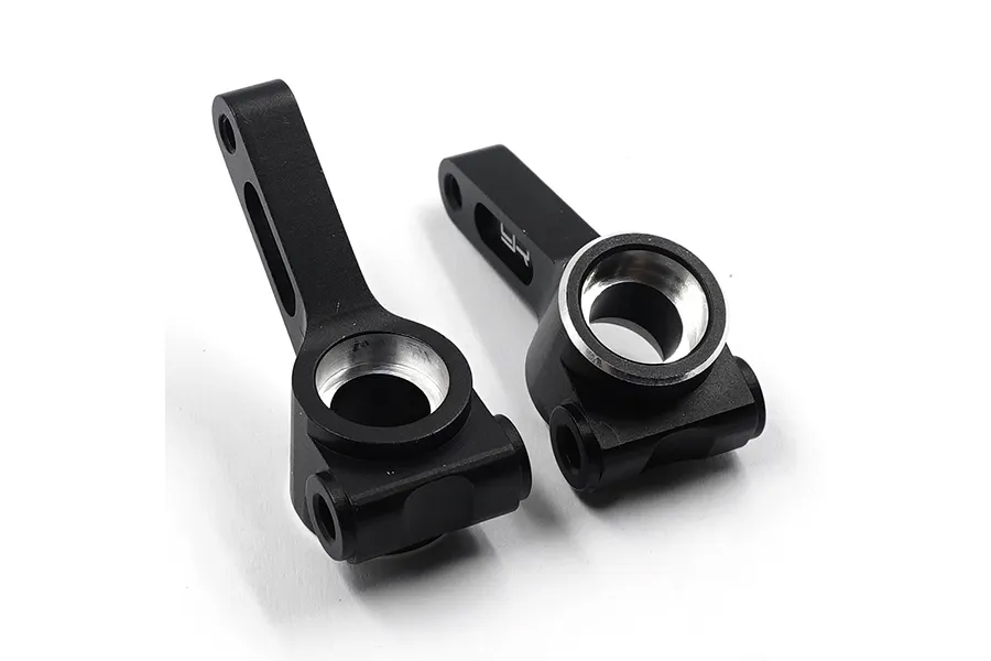 A pair of black anodized aluminium rear hubs for RC cars by Yeah Racing, featuring silver machined edges and mounting points.