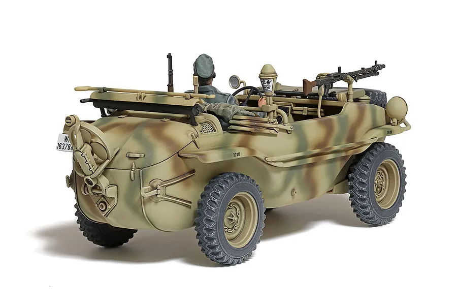 A rear three-quarter view of a painted 1/35 scale Tamiya German Schwimmwagen T166 model kit with a soldier figure driving.