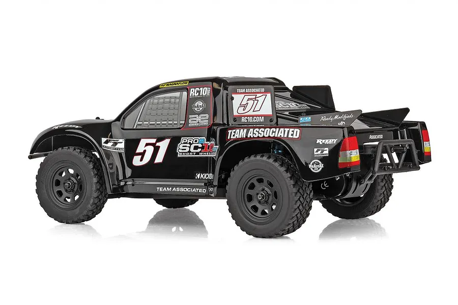 Rear three-quarter view of a black Team Associated Pro2 SC10 RC short course truck with number 51 decals on a white background.