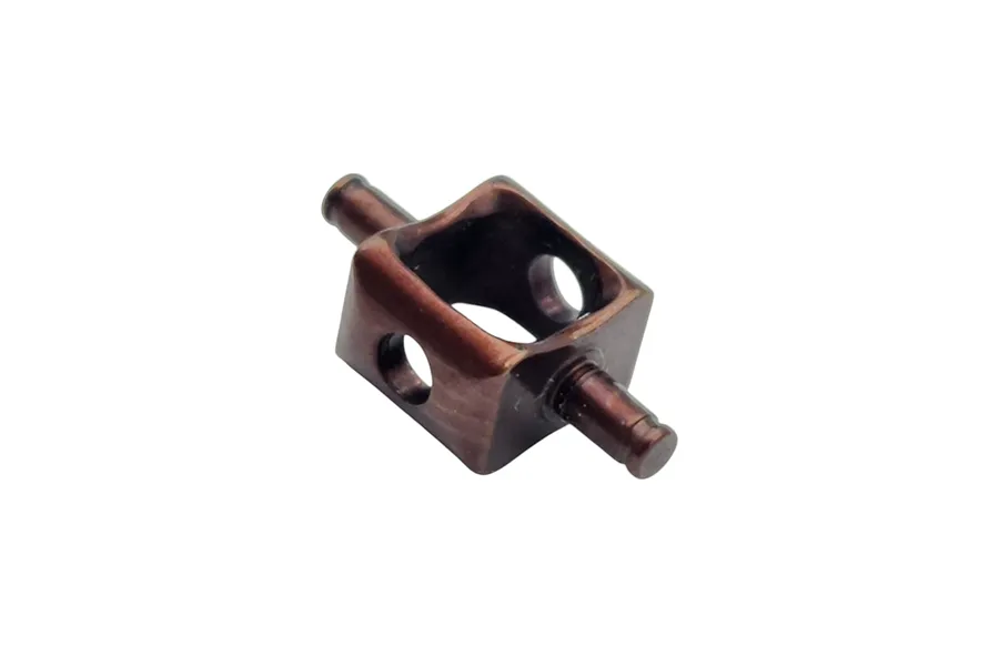 A dark metallic RC inner driveshaft coupler with a U-joint style design, shown against a plain white background.