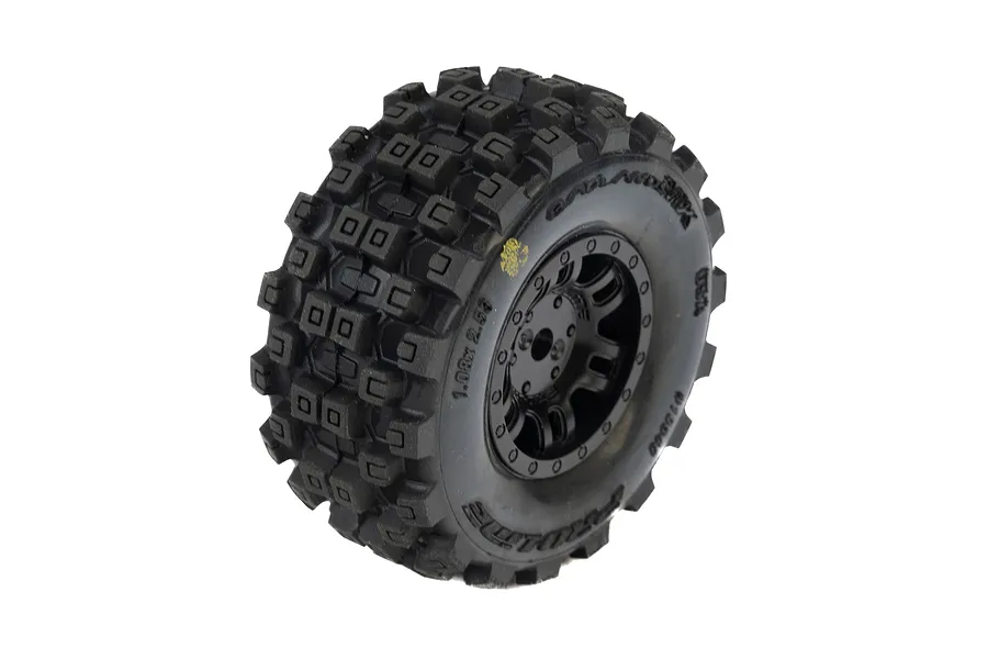 A single Pro-Line Badlands MX tyre mounted on a black Split Six rim, shown against a white background.