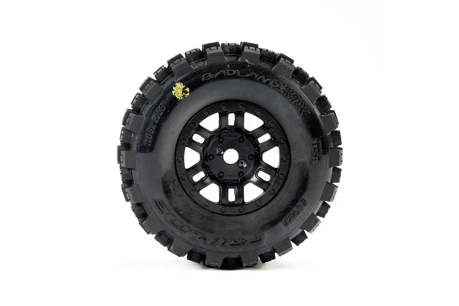 A single Pro-Line Badlands MX tyre mounted on a black Split Six rim, viewed from the front against a white background.