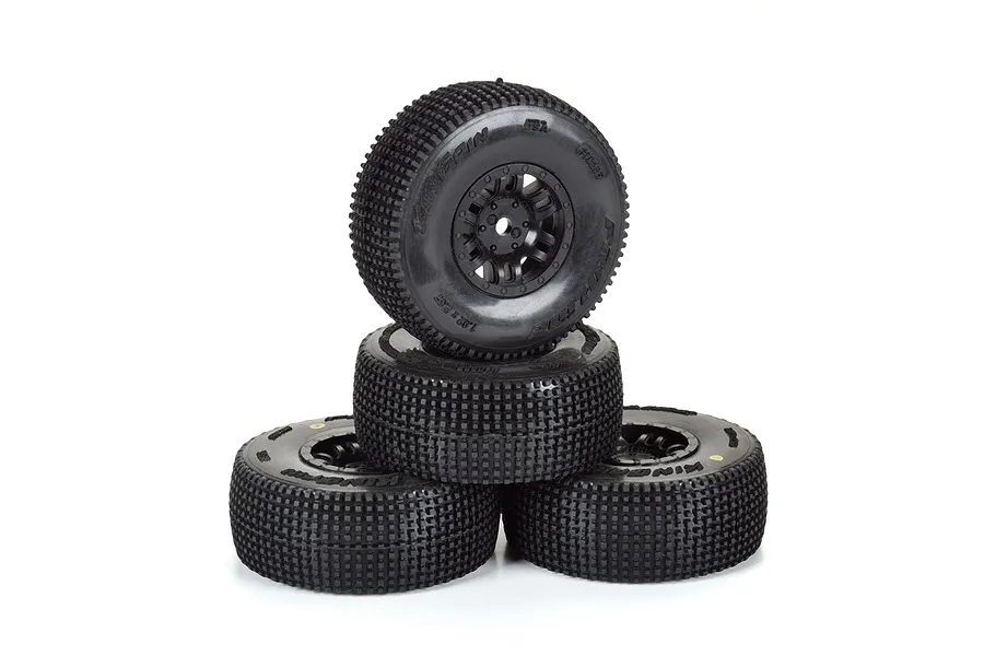 A stack of four black Pro-Line King Pin RC tyres pre-mounted on black Split Six rims against a white background.