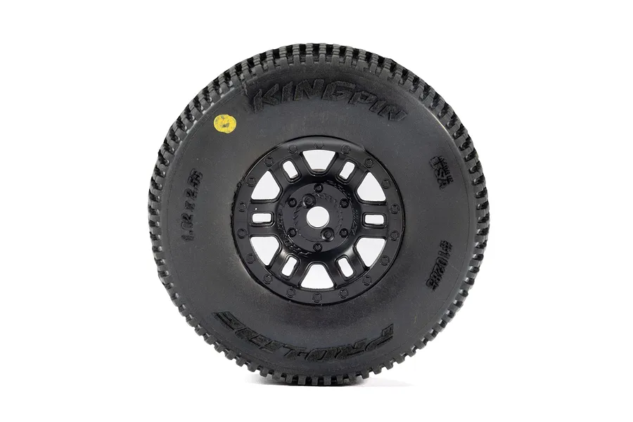A single Pro-Line King Pin RC tyre mounted on a black Split Six rim, viewed from the side against a white background.